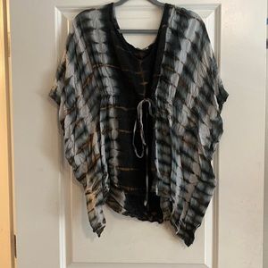 Loose short sleeve shirt. Cute as a swim suit cover up or with white shorts